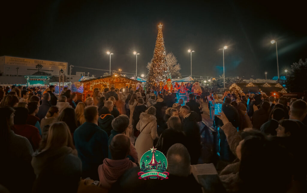 Families enjoying Christmas Park at VILLAGE shopping & more during the holiday season